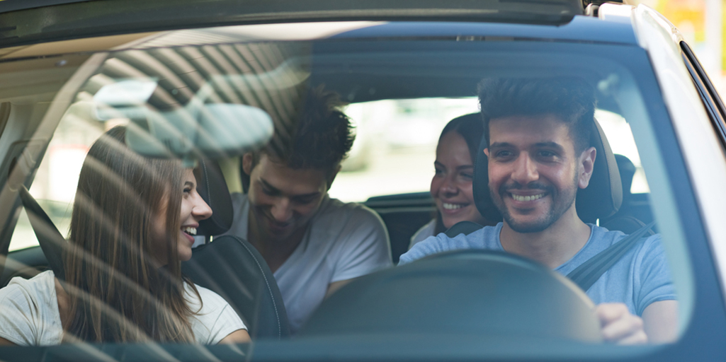 group of friends inside a car